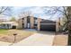 Charming two-story home with a well-manicured lawn and attached two car garage at 3134 S Fairplay St, Aurora, CO 80014