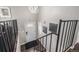Home foyer featuring modern chandelier, metal stair railing, and decorated walls at 3134 S Fairplay St, Aurora, CO 80014