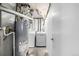 Functional laundry room with a washer, dryer and hot water heater at 3134 S Fairplay St, Aurora, CO 80014