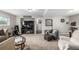 Spacious living room with neutral paint, carpet, furniture and tv at 3134 S Fairplay St, Aurora, CO 80014
