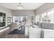 Bright living room featuring a dining area and large windows for natural light at 3134 S Fairplay St, Aurora, CO 80014