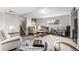 Cozy living room with comfortable seating, carpet, and natural light at 3134 S Fairplay St, Aurora, CO 80014