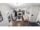 Large living room with hardwood floors, modern lighting, and a cozy fireplace at 3134 S Fairplay St, Aurora, CO 80014