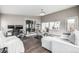 Living area with workspace, featuring sliding door access and modern decor at 3134 S Fairplay St, Aurora, CO 80014