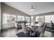 Bright living area with a dining table, large windows, and access to the backyard at 3134 S Fairplay St, Aurora, CO 80014