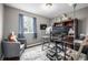 Home office featuring a spacious desk, shelves, and a comfortable chair at 3134 S Fairplay St, Aurora, CO 80014