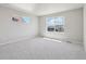 Bright, spacious bedroom with carpet flooring and windows providing natural light at 7241 Goldbloom Ln, Littleton, CO 80125
