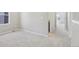 Bright bedroom with neutral walls, carpet, and a view to another room at 7241 Goldbloom Ln, Littleton, CO 80125