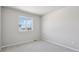 Clean and comfortable bedroom featuring soft carpeting and a window at 7241 Goldbloom Ln, Littleton, CO 80125