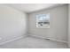 Cozy bedroom with plush carpeting and a window, offering a peaceful retreat at 7241 Goldbloom Ln, Littleton, CO 80125