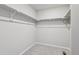 Walk-in closet with shelving and carpet flooring at 7241 Goldbloom Ln, Littleton, CO 80125