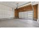 Spacious garage with a white garage door and an automatic door opener at 7241 Goldbloom Ln, Littleton, CO 80125