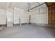Spacious garage with concrete floor and a door leading to the interior of the home at 7241 Goldbloom Ln, Littleton, CO 80125