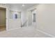 Open second story hallway with carpet, neutral paint, and natural light at 7241 Goldbloom Ln, Littleton, CO 80125