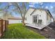 Exterior of home with grassy area and deck that allows you to enjoy outdoor living at 22 S Harlan St, Lakewood, CO 80226