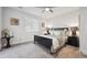 Spacious bedroom featuring neutral walls, carpet, ceiling fan, and a well-lit window at 22 S Harlan St, Lakewood, CO 80226