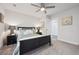 Bedroom with ceiling fan, carpet, neutral walls, and a view of the closet at 22 S Harlan St, Lakewood, CO 80226