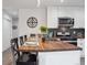 Kitchen with a breakfast bar and butcher block countertop, perfect for casual dining and entertaining at 22 S Harlan St, Lakewood, CO 80226