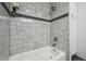 Shower with stylish tile, showerhead, and a sleek design perfect for relaxation at 22 S Harlan St, Lakewood, CO 80226