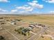 Expansive aerial view of home with large lot, white fence and outbuilding, in a quiet rural community at 56330 E 37Th Ct, Strasburg, CO 80136