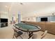 Finished basement featuring a lounge area, pool table, poker table and tv at 56330 E 37Th Ct, Strasburg, CO 80136