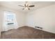 Neutral bedroom features a ceiling fan, and plush carpeted floors at 56330 E 37Th Ct, Strasburg, CO 80136