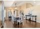 Bright dining room with hardwood floors, vaulted ceiling, and views to other parts of this inviting home at 56330 E 37Th Ct, Strasburg, CO 80136