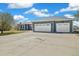 Spacious two-car garage with a concrete driveway providing ample parking and convenient access to the house at 56330 E 37Th Ct, Strasburg, CO 80136