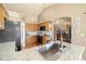 Bright kitchen features granite countertops, stainless steel appliances, and light wood cabinetry at 56330 E 37Th Ct, Strasburg, CO 80136