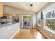 Bright kitchen area with stainless appliances, and a sliding glass door leading to the patio at 56330 E 37Th Ct, Strasburg, CO 80136