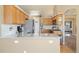 Modern kitchen with granite countertops, stainless steel appliances, and ample cabinet space for storage and meal preparation at 56330 E 37Th Ct, Strasburg, CO 80136