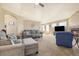Comfortable living room with cozy seating, a fireplace, and plenty of natural light for a relaxing atmosphere at 56330 E 37Th Ct, Strasburg, CO 80136