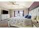 Spacious main bedroom with neutral carpeting, a ceiling fan, and great natural light at 56330 E 37Th Ct, Strasburg, CO 80136