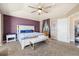 Spacious main bedroom with a ceiling fan, great natural light, and neutral carpeting at 56330 E 37Th Ct, Strasburg, CO 80136