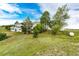 Spacious backyard featuring a well-maintained lawn and landscaping, all enclosed by a chain link fence at 43388 Somerset Ct, Elizabeth, CO 80107