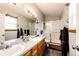 Spacious bathroom with double sinks, generous counter space, and a glass-enclosed shower at 43388 Somerset Ct, Elizabeth, CO 80107