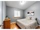 Cozy bedroom with hardwood floors, neutral paint, and bright natural light at 43388 Somerset Ct, Elizabeth, CO 80107