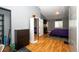 Bright bedroom featuring hardwood floors, ample closet space, and a window for natural light at 43388 Somerset Ct, Elizabeth, CO 80107