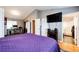Comfortable bedroom with attached bath, TV, and nearby office space at 43388 Somerset Ct, Elizabeth, CO 80107
