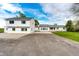 Expansive home featuring bright white siding, well-kept lawn and extra parking perfect for multiple vehicles or RV storage at 43388 Somerset Ct, Elizabeth, CO 80107