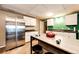 A compact kitchen featuring modern appliances, white cabinets, and lots of counter space at 43388 Somerset Ct, Elizabeth, CO 80107