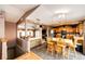 Open concept kitchen and living area features eat in bar, tile flooring, and modern appliances at 43388 Somerset Ct, Elizabeth, CO 80107