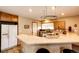 Eat-in kitchen with stainless steel appliances and breakfast bar at 43388 Somerset Ct, Elizabeth, CO 80107
