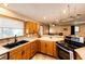 Well-lit kitchen features breakfast bar, modern appliances, and natural lighting at 43388 Somerset Ct, Elizabeth, CO 80107