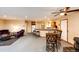 Bright open-concept living area flows into kitchen with breakfast bar and seating, perfect for entertaining at 43388 Somerset Ct, Elizabeth, CO 80107