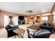 Inviting living room featuring two cozy sofas, open access to the kitchen, neutral carpet and ample space for relaxation at 43388 Somerset Ct, Elizabeth, CO 80107