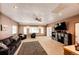 Spacious living room with plush seating, large windows for natural light, and a ceiling fan for added comfort at 43388 Somerset Ct, Elizabeth, CO 80107