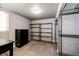 Storage room with shelving units, dresser and carpeted floor at 43388 Somerset Ct, Elizabeth, CO 80107