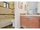 Cozy bathroom with tiled shower and a granite vanity at 534 E 7Th Ave # 107, Denver, CO 80203