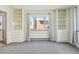 Spacious bedroom with built-in shelving and large windows at 534 E 7Th Ave # 107, Denver, CO 80203